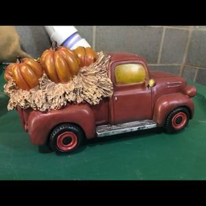 Red truck with fall pumpkins decor